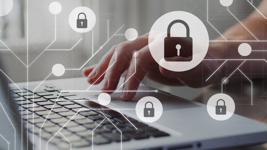 Close-up of hands typing on a laptop keyboard, with overlay graphics of padlocks and a network diagram, symbolizing cybersecurity and data protection. Multiple padlock icons are interconnected, emphasizing security in the digital environment.