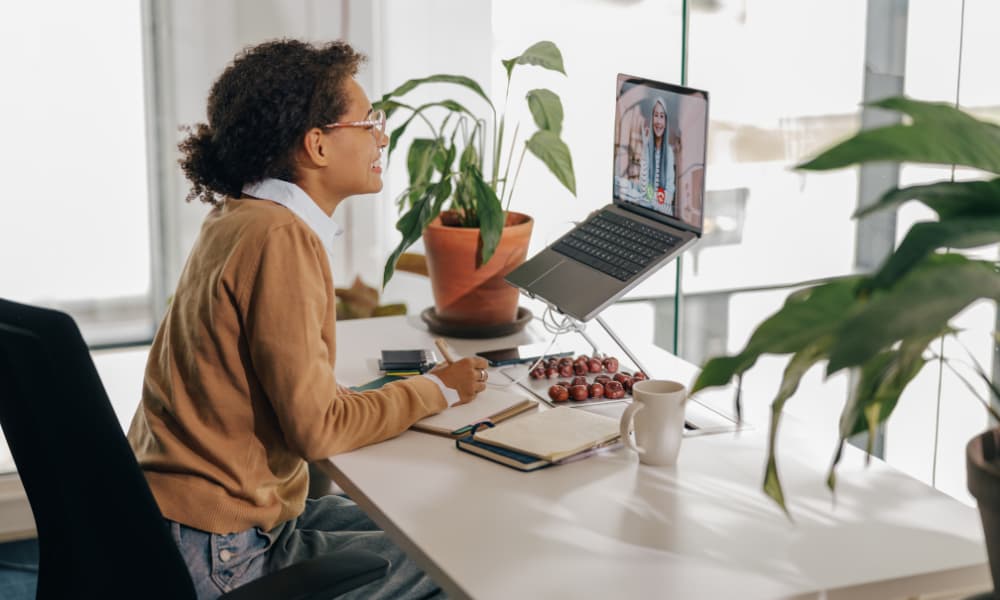 Female remote worker in a video conference.